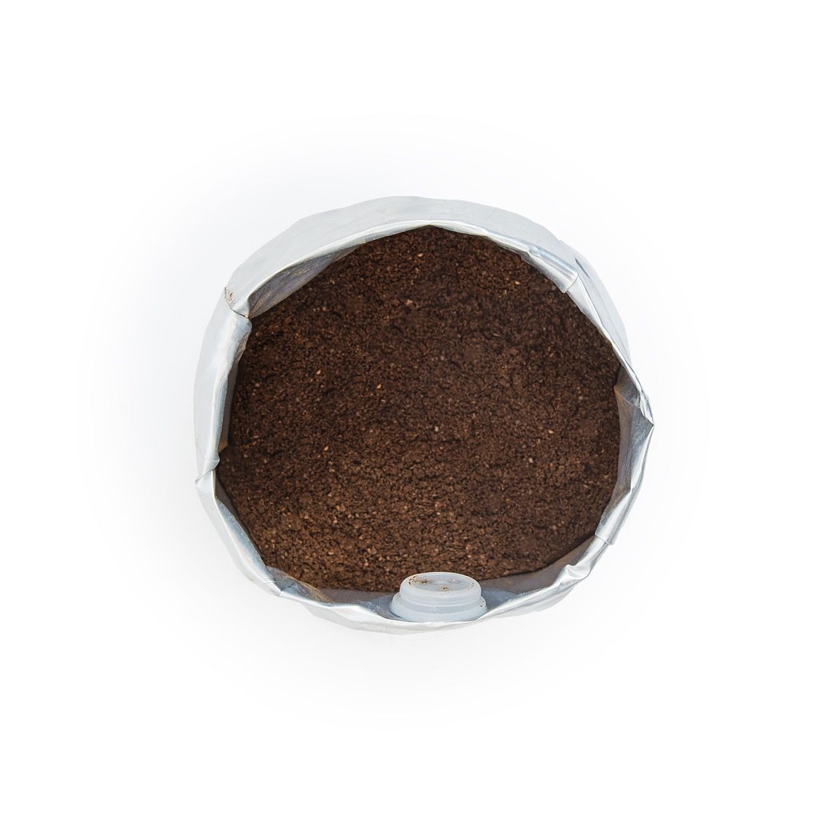 Close-up of Frida Drip ground coffee showing fine texture for filter and drip brewing.