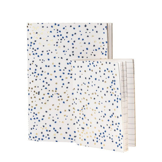 Pair of MOGI notebook with golden and blue dots.