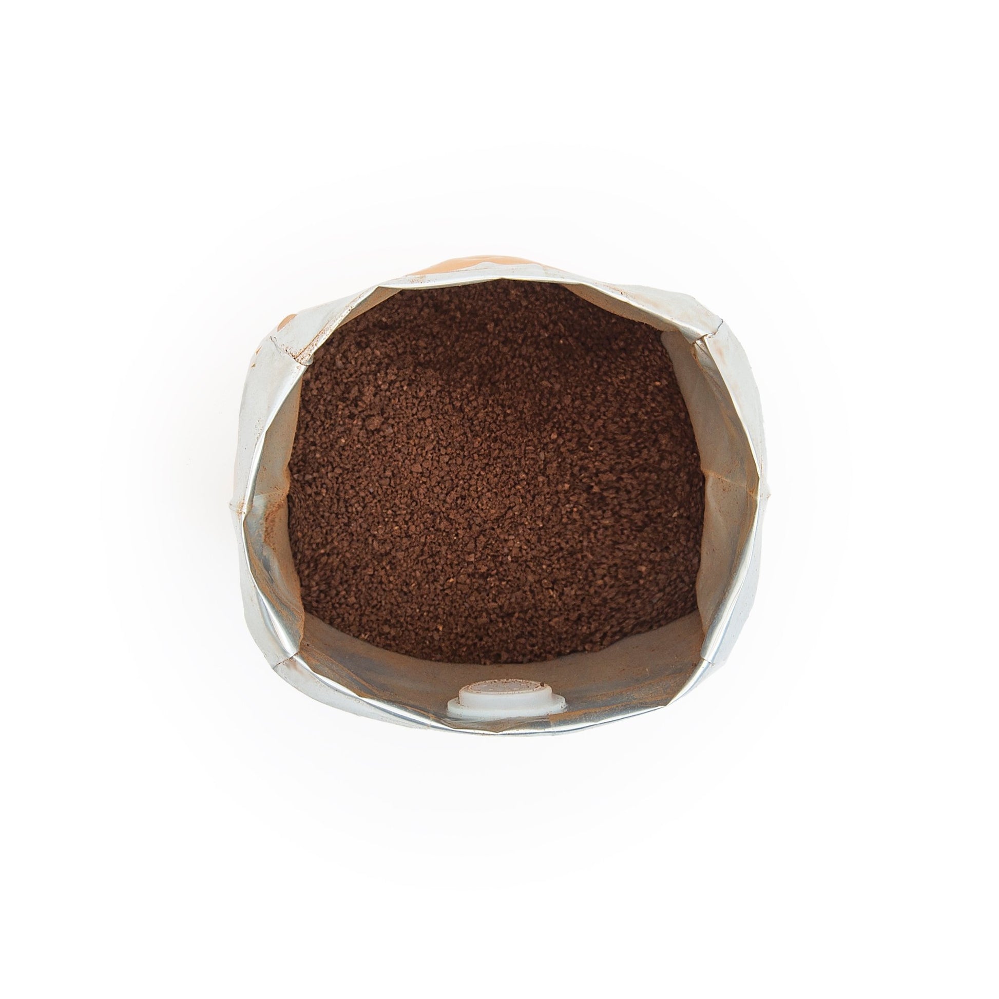 Close-up of Polaris Drip ground coffee showing fine texture for filter and drip brewing.